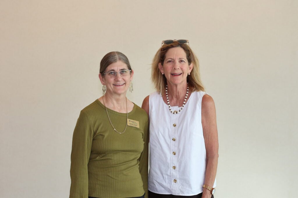 Debbie Busby & Kay Mason at the Impact100 of Northwest Florida 2026 Member and Grant Number Reveal in Fort Walton Beach, Florida.