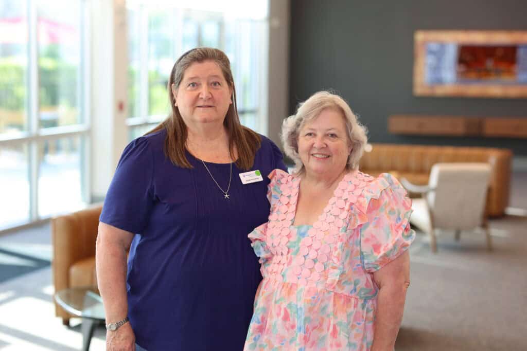 Jessie Hovatter & Angie Toole at the Impact100 of Northwest Florida 2026 Member and Grant Number Reveal in Fort Walton Beach, Florida.