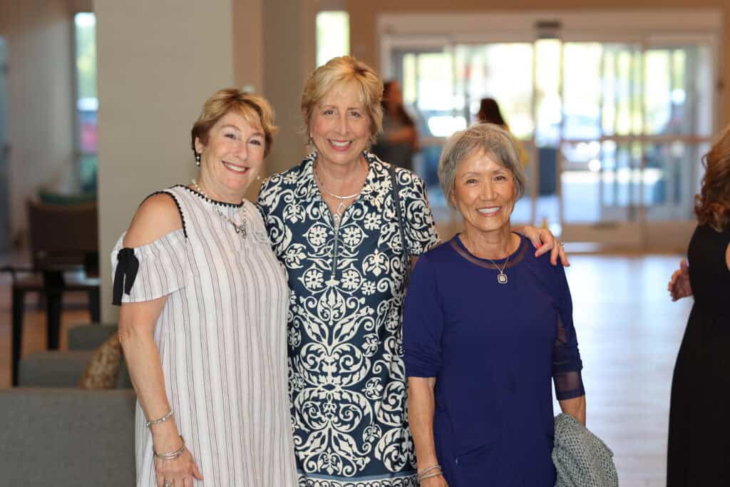 Lori Burkhart, Teresa Allen & Sarah Baker at the Impact100 of Northwest Florida 2026 Member and Grant Number Reveal in Fort Walton Beach, Florida.