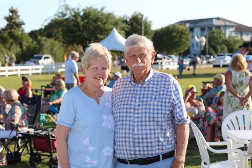 Gwen & Roy Sutton at the 2026 Concerts in the Village Featuring A1A - The Official Jimmy Buffet Tribute Band in Destin, FL.